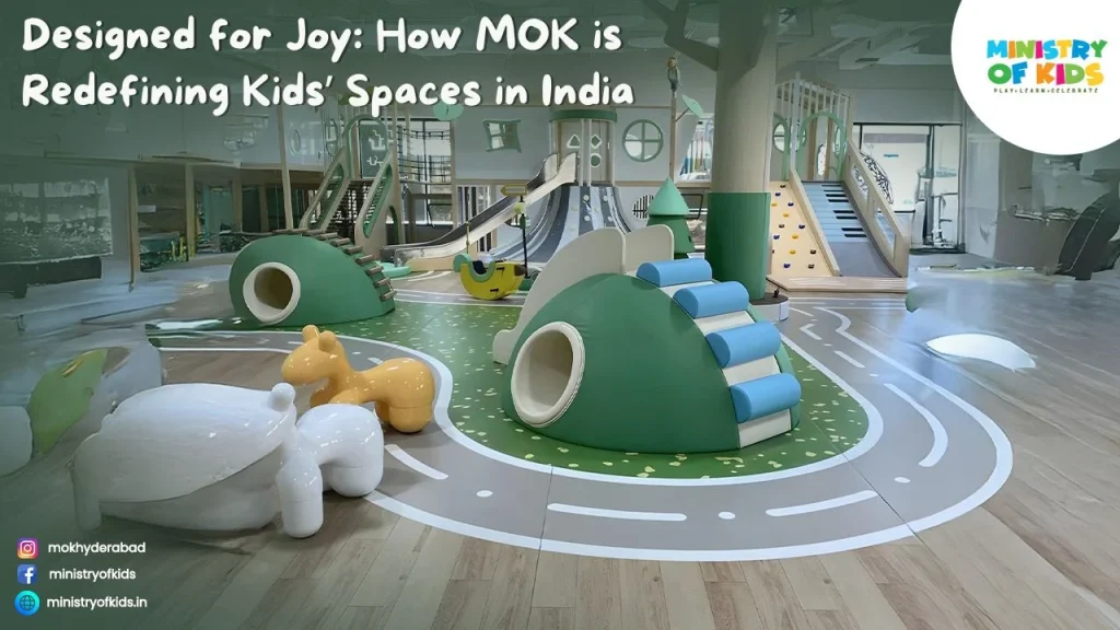 A modern indoor children’s play space in India featuring pastel-green climbing structures, slides, play tunnels, animal-shaped seats, and a road-themed floor design, with the heading “Designed for Joy: How MOK is Redefining Kids’ Spaces in India.”
