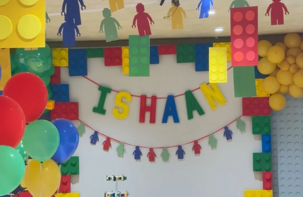 Birthday party ideas for kids in Hyderabad: colourful building-block decorations with balloons and hanging character cutouts